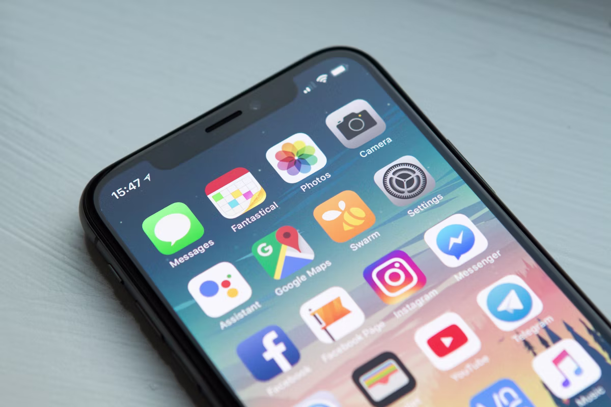 Hands holding a smartphone mid-use